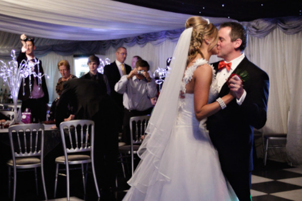 Dancefloor kiss in a fully lined clearspan marquee