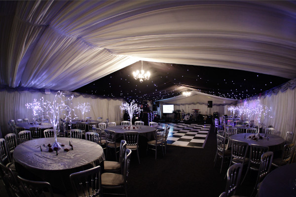 Fully lined clearspan marquee for a christmas wedding with black and white dancefloor