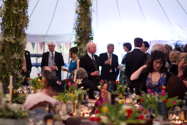 Guests inside a traditional marquee hired from Burgoynes Marquees